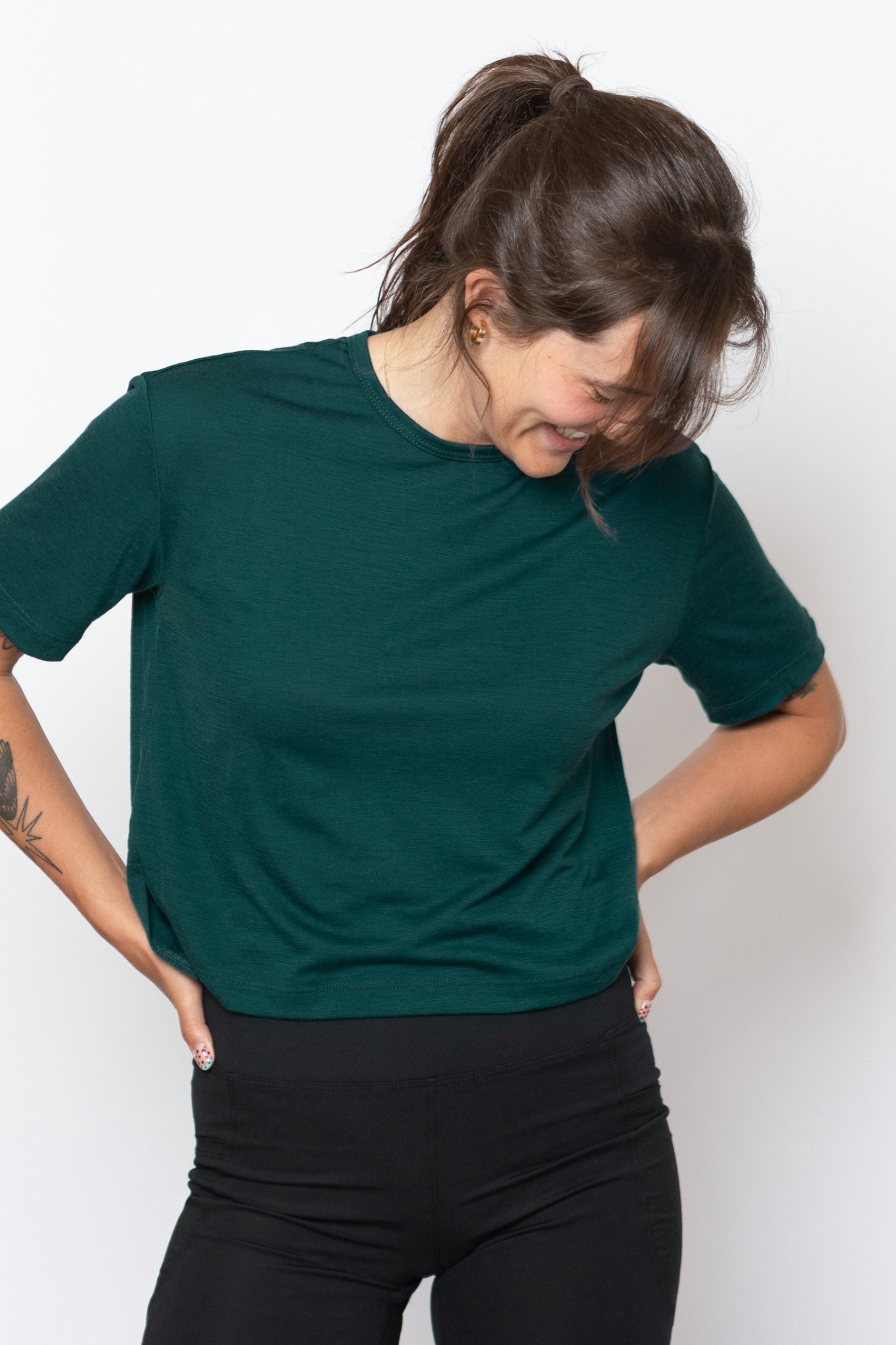 Alpine Fit Forest Green Merino Wool Travel T-Shirt worn by a model, front view