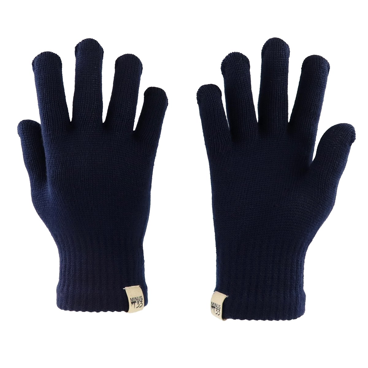 Close up of Minus33 merino wool glove liners in the color navy blue on a white background.
