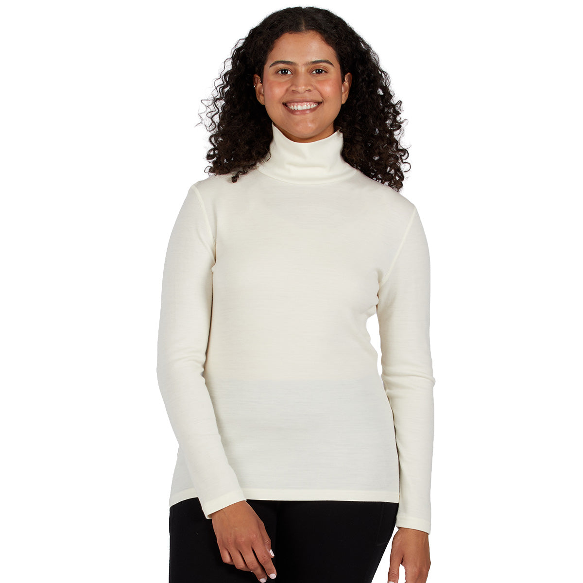 a cream-colored ribbed turtleneck sweater and black pants, merino wool