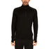 A man models the merino wool midweight quarter zip sweater, tall, complete with flat-lock seams and thumbholes.