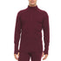 A man models the merino wool midweight quarter zip sweater, complete with flat-lock seams and thumbholes.