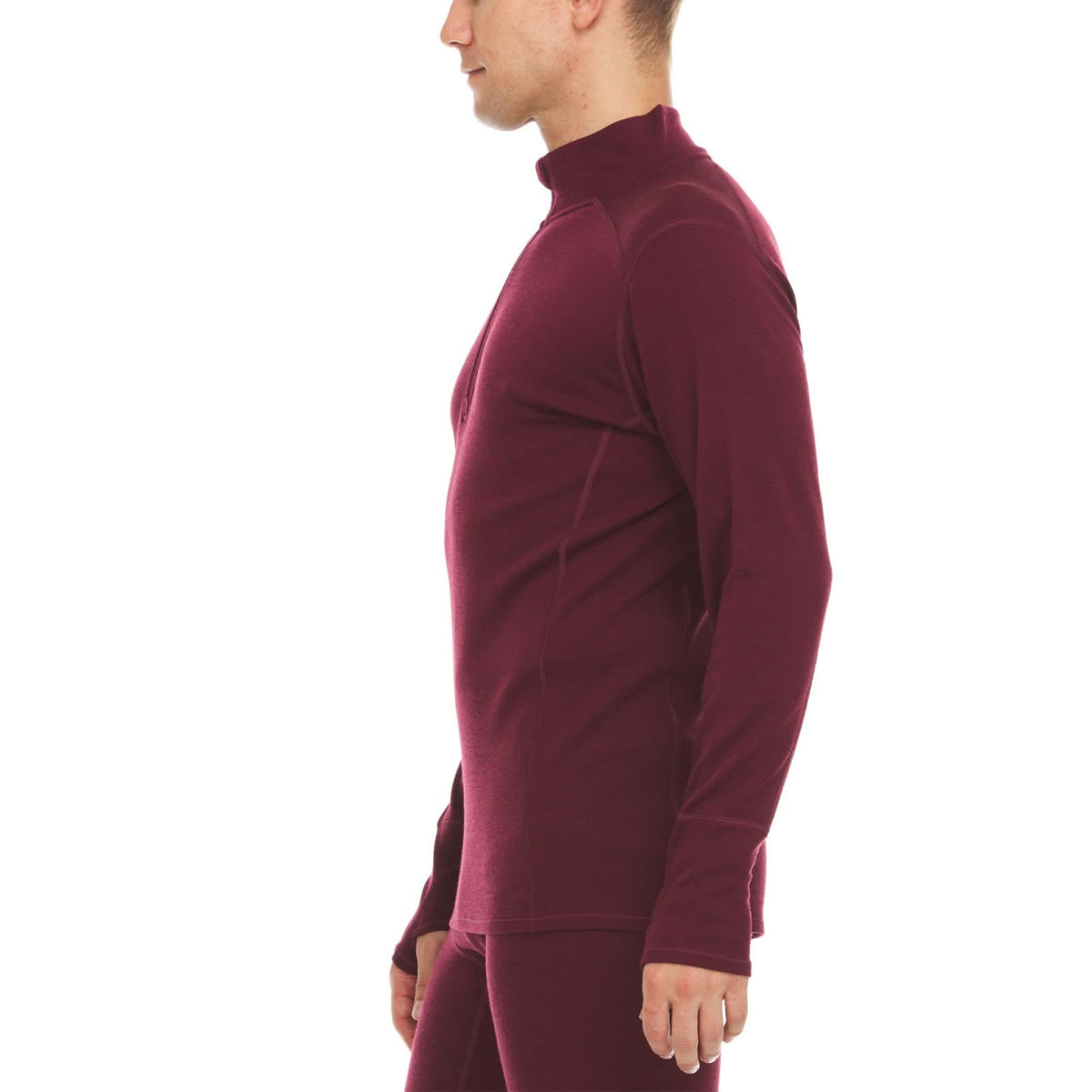 A man models the merino wool midweight quarter zip sweater, complete with flat-lock seams and thumbholes, right-facing side view