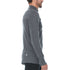 Side view of a man modeling the merino wool midweight quarter zip sweater in charcoal gray, complete with flat-lock seams and thumbholes.