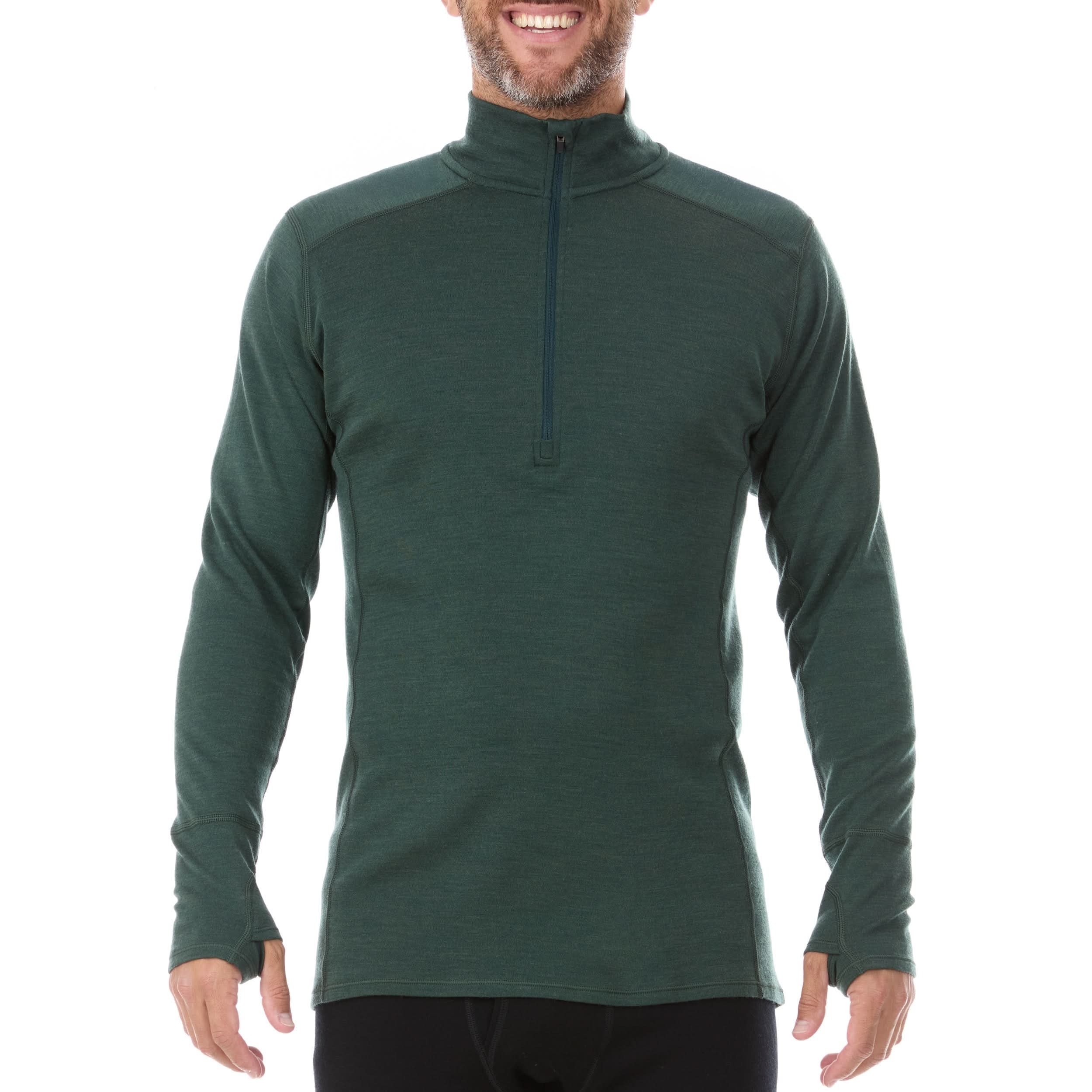 A man models the merino wool midweight quarter zip sweater, complete with flat-lock seams and thumbholes.