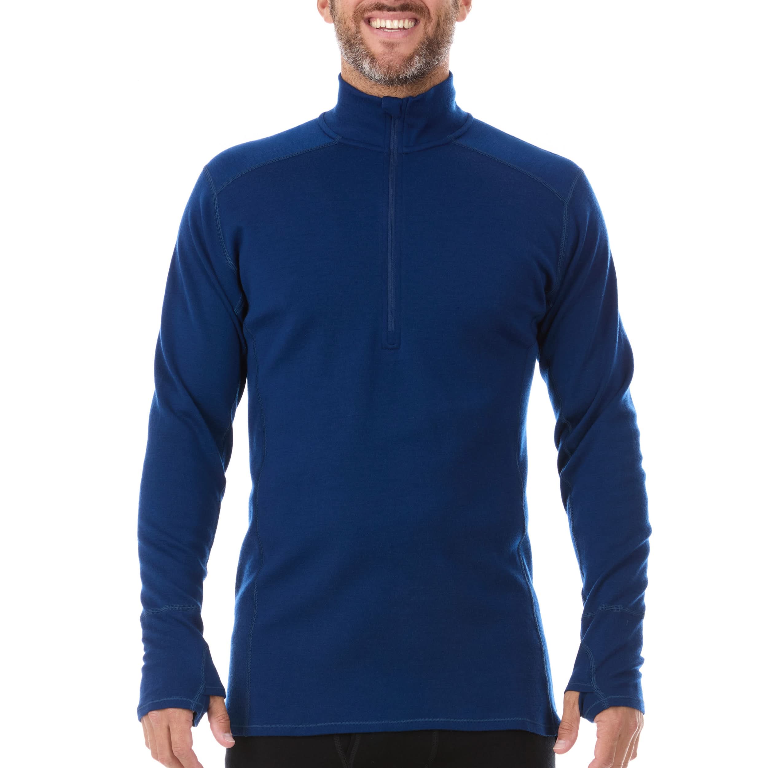 A man models the merino wool midweight quarter zip sweater, complete with flat-lock seams and thumbholes, front view