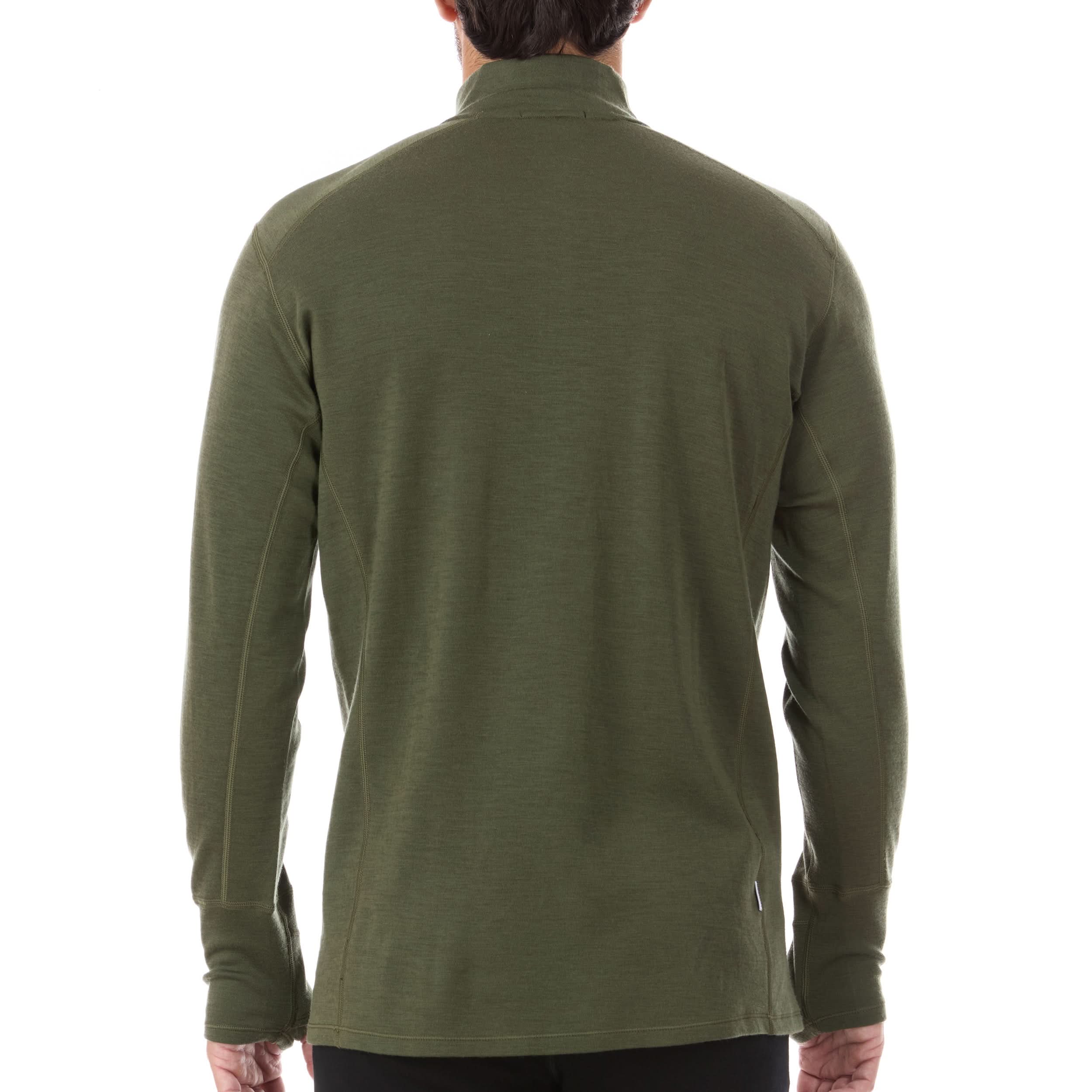 A man models the merino wool midweight quarter zip sweater, complete with flat-lock seams and thumbholes.