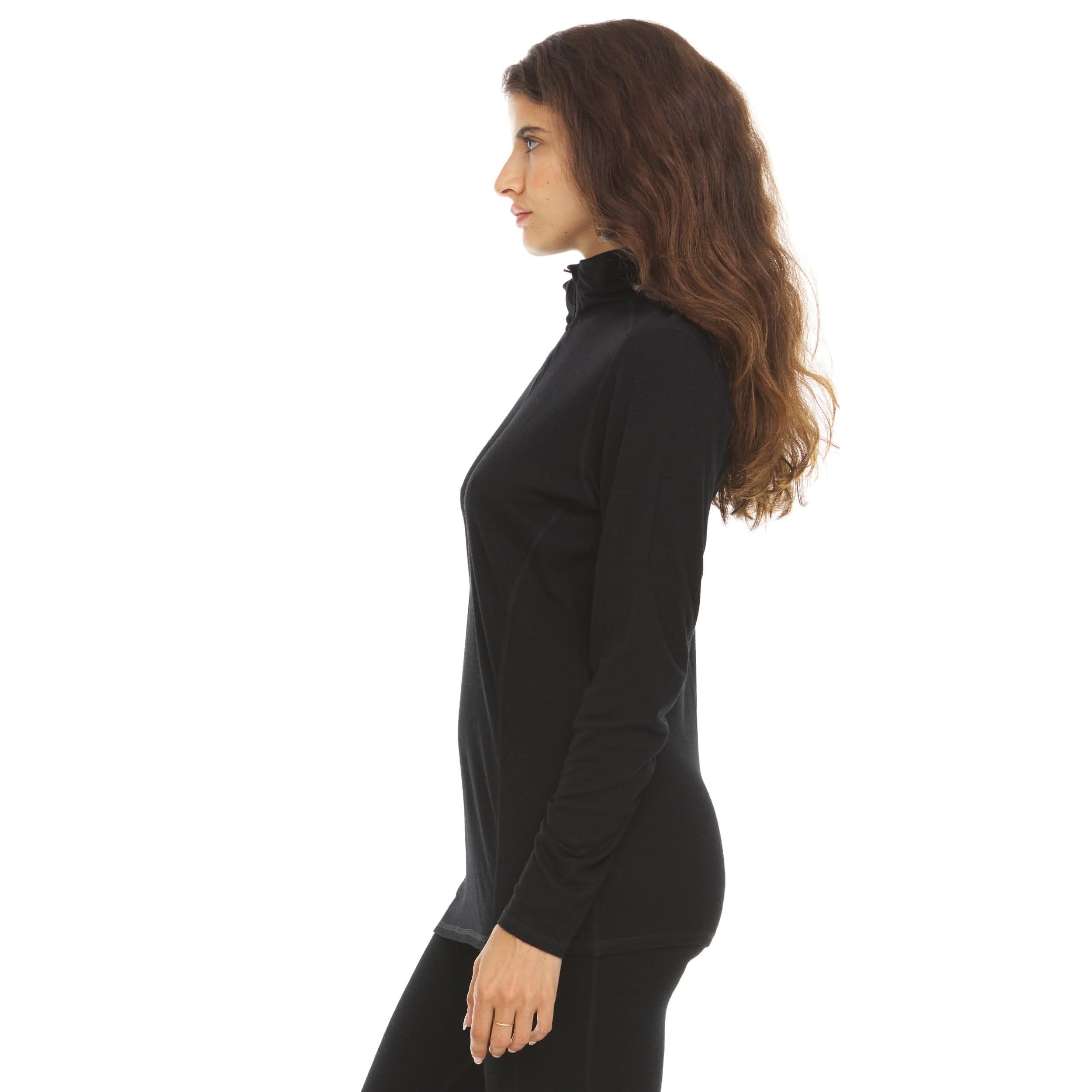 Left side view of a woman wearing a black micro weight merino wool quarter-zip top, showing the stand collar, zipper edge, fitted sleeve, shaped side seam, and smooth hem