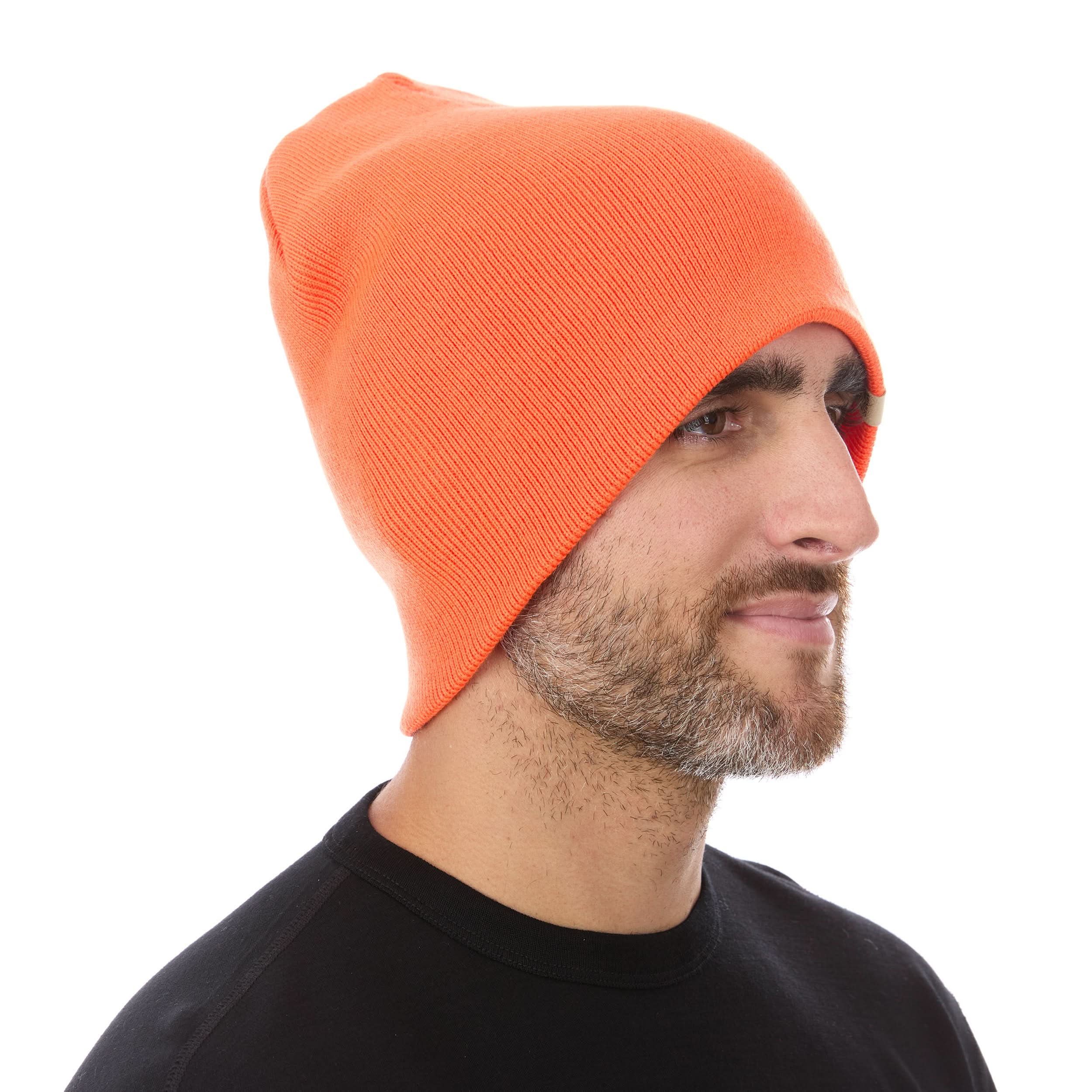 A man models a heavyweight, super soft, one hundred percent merino wool beanie. This heavyweight beanie is the warmest hat that we offer, perfect for hiking through the White Mountains, or sitting at a bonfire in January.