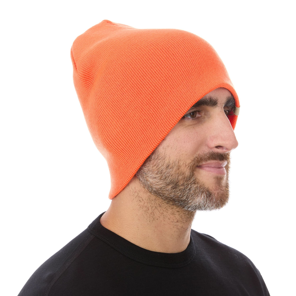 A man models a heavyweight, super soft, one hundred percent merino wool beanie. This heavyweight beanie is the warmest hat that we offer, perfect for hiking through the White Mountains, or sitting at a bonfire in January.