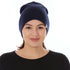 A woman models a heavyweight, super soft, one hundred percent merino wool beanie. This heavyweight beanie is the warmest hat that we offer, perfect for hiking through the White Mountains, or sitting at a bonfire in January.