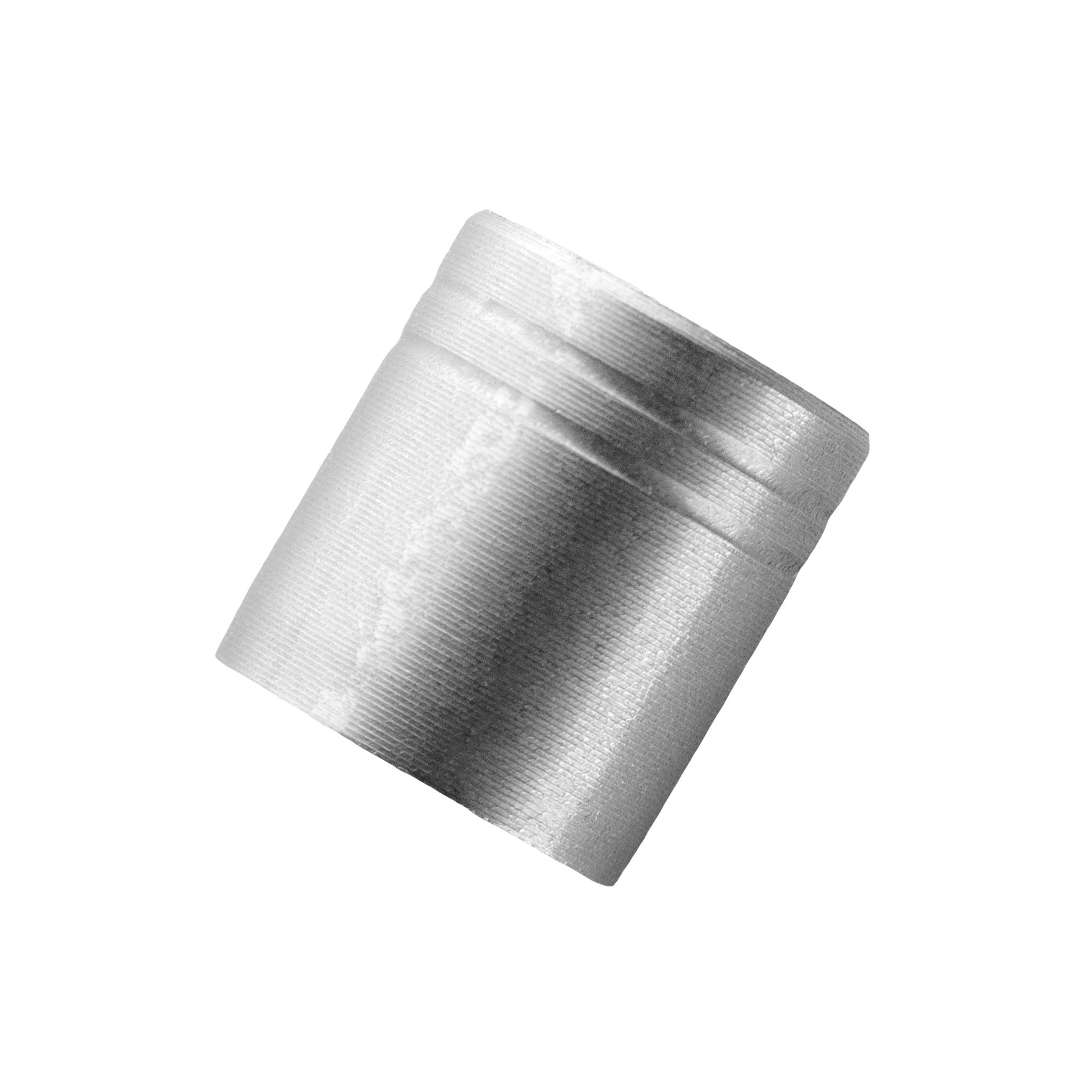 Close-up of a short silver-colored arrow collar with a shallow groove near its rim.