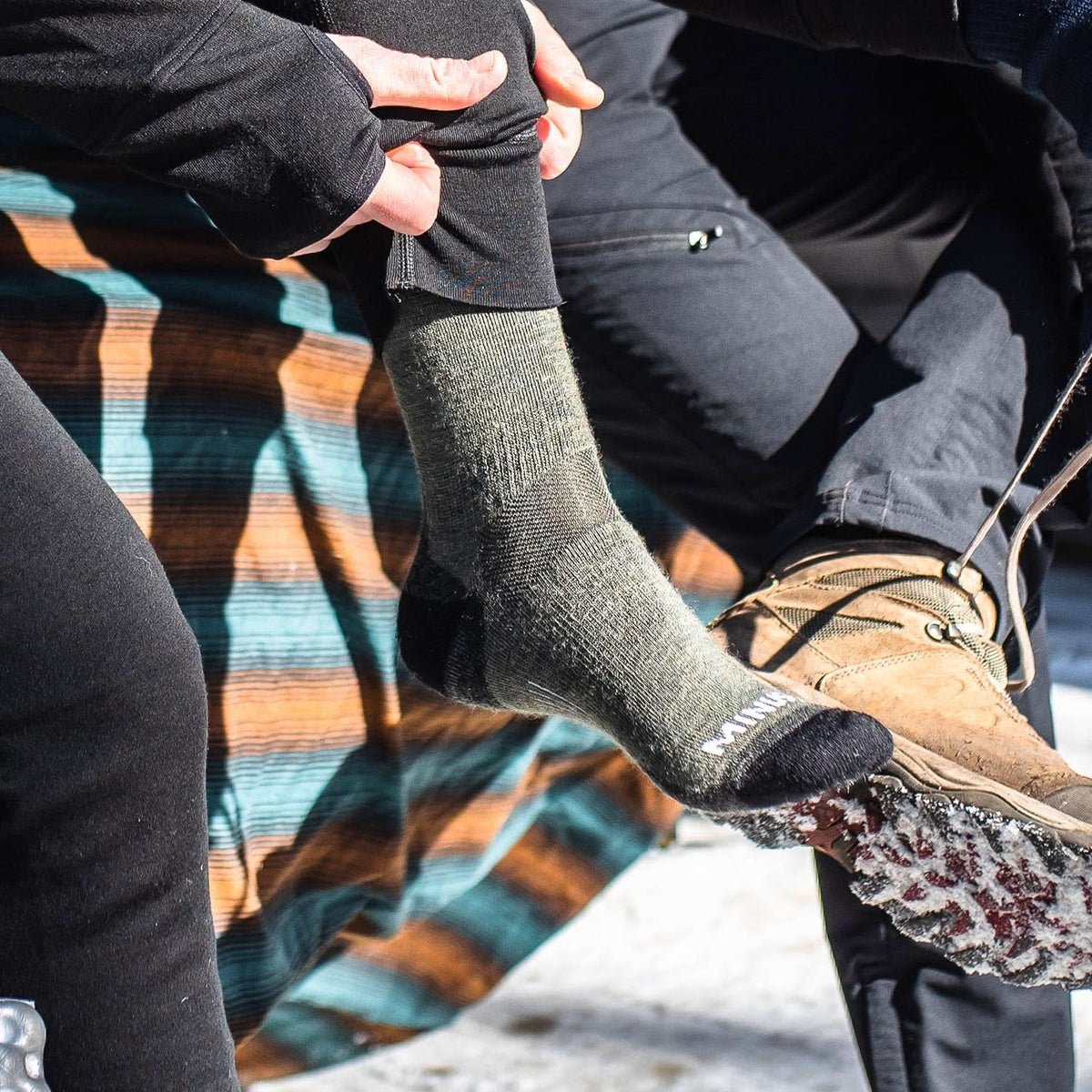 NH USA Made Merino Wool crew socks. Best all season lightweight merino wool crew socks, close-up of sock worn beside a hiking boot