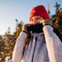 woman hiking pulling up her expedition weight neck gaiter