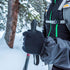 Hiker clasps trekking pole handles with lightweight merino liners