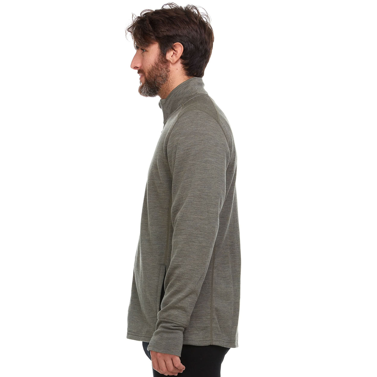 Back view of a man wearing a granite green Wilderness Expedition heavyweight merino wool full-zip jacket, showing the stand collar, long sleeves, straight back, and hip-length hem