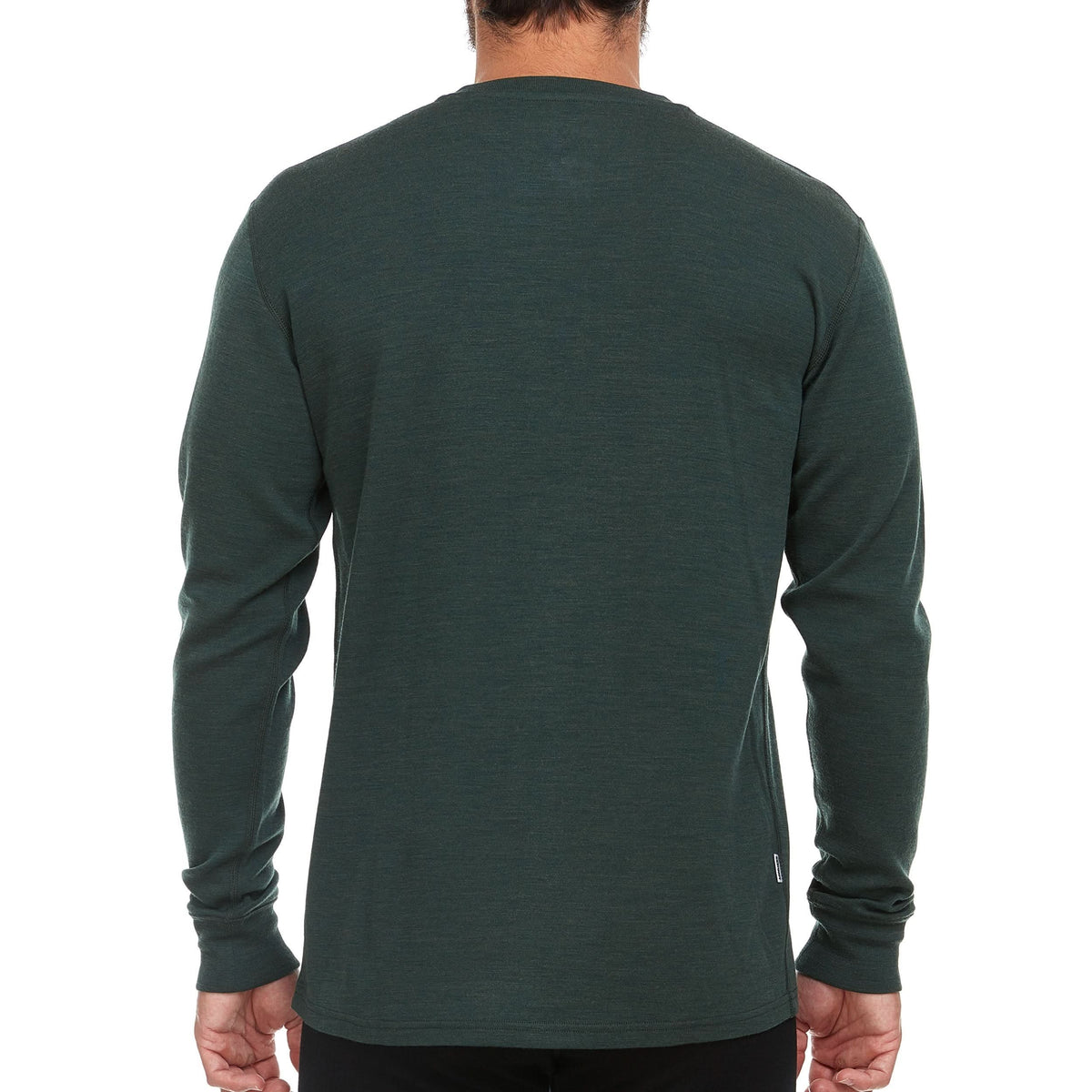 Back view of a man wearing a forest green midweight merino wool long-sleeve henley shirt, showing the smooth crew-neck back, straight shoulder seams, fitted cuffs, and rounded hip-length hem