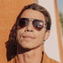 Sunski Astra Polarized Sunglasses - Tortoise Amber - Man wearing sunglasses with a warm-toned filter
